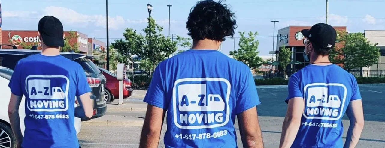 young-worker-loading-cardboard-boxes-delivery-van-communicating-with-his-colleague