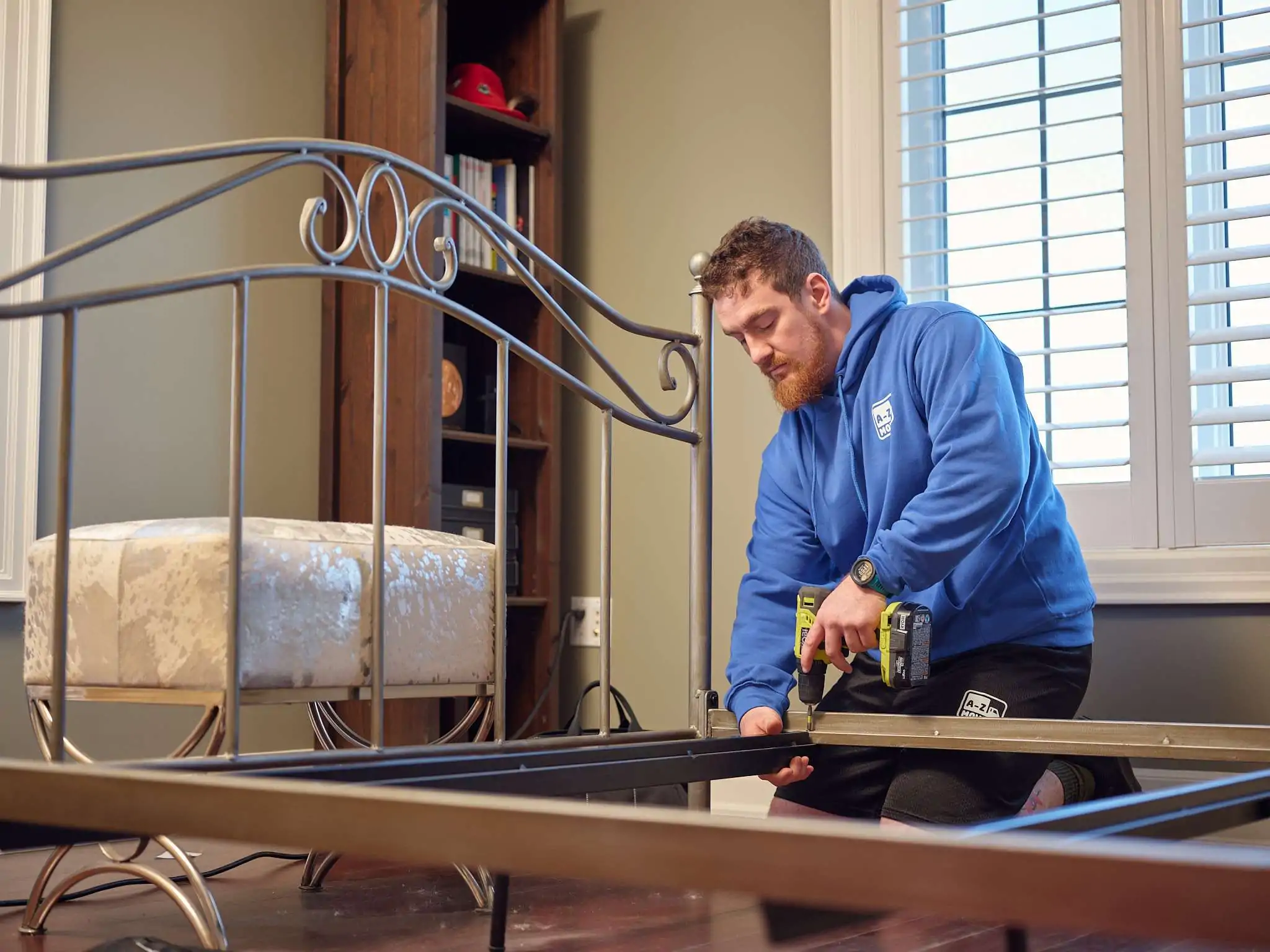 young-delivery-man-using-touchpad-while-reading-label-package 1