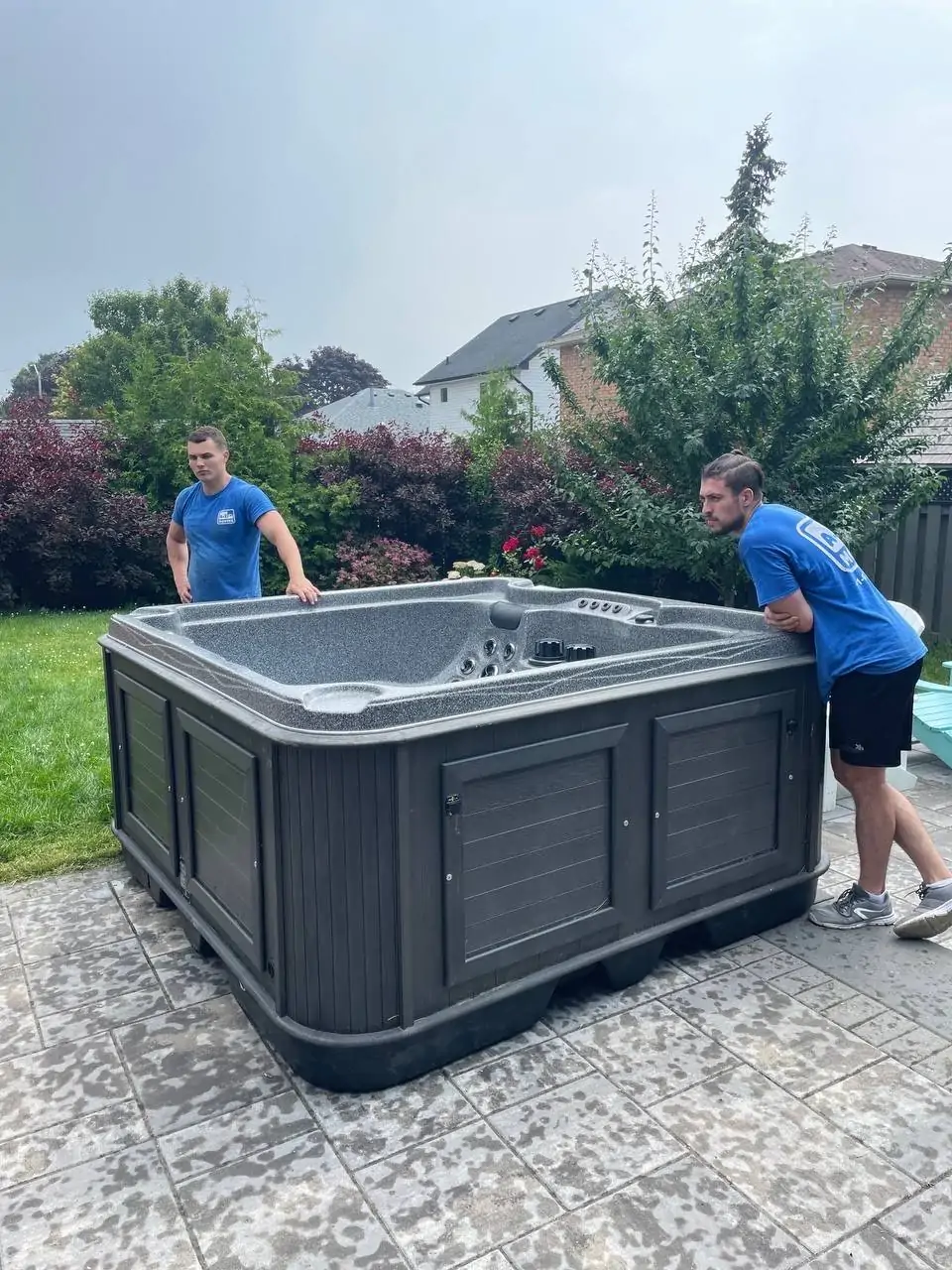 young-delivery-man-using-touchpad-while-reading-label-package 1